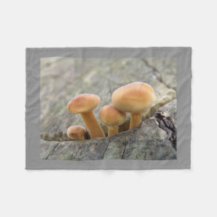 Toadstools on a Tree Trunk Fleece Blanket