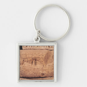 Tombstone depicting a fishing boat key ring
