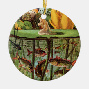 Tommelise very desolate on the water lily leaf, in ceramic tree decoration