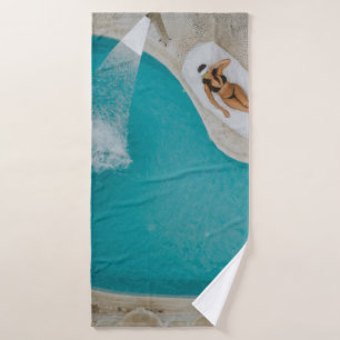 Top-angle photography of outdoor swimming pool bath towel
