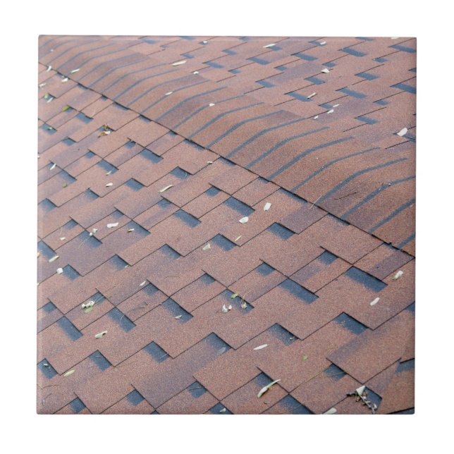 Top view of brown roof shingles with a few autumn tile (Front)