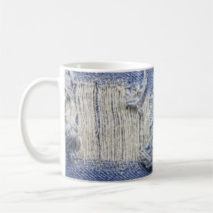 Torn blue denim: jeans texture. coffee mug