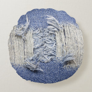 Torn blue denim: jeans texture. round cushion