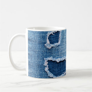 Torn denim fabric texture, blue hues. coffee mug