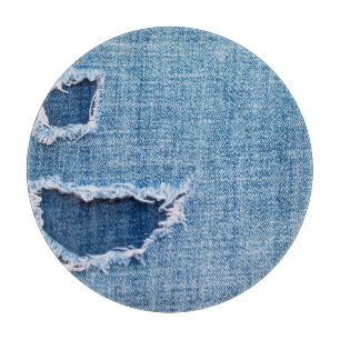 Torn denim fabric texture, blue hues. cutting board