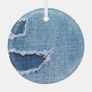 Torn denim fabric texture, blue hues. glass tree decoration