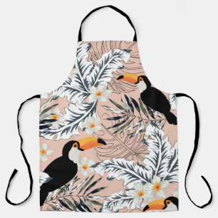 Toucans, graphic palm leaves, plumeria flowers, pa apron