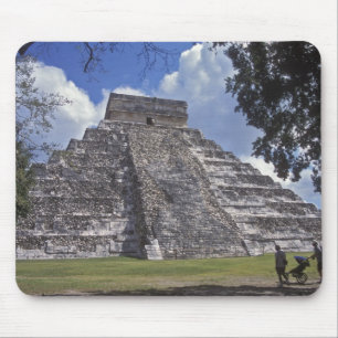 Tourists walk past an unrestored side of El 2 Mouse Mat