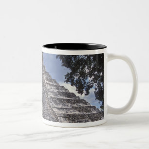 Tourists walk past an unrestored side of El 2 Two-Tone Coffee Mug