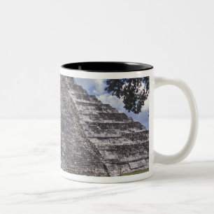 Tourists walk past an unrestored side of El Two-Tone Coffee Mug