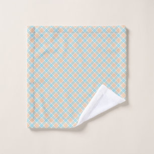 Towels and a washcloth with a pastel blue