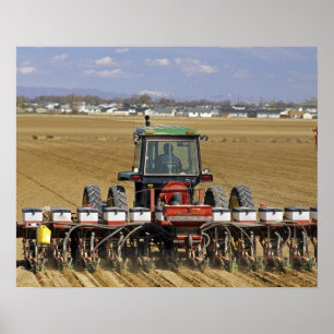 Tractor pulling a seed corn planter. poster