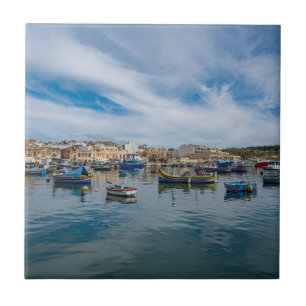 Traditional colorful fishing boats in the harbor tile