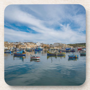 Traditional colourful fishing boats in the harbour coaster
