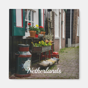 Traditional dutch wooden shoes on street magnet