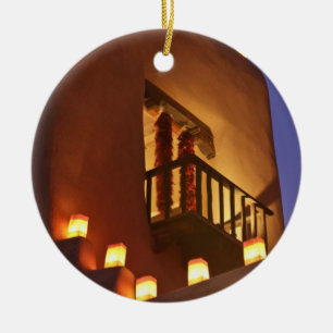 Traditional farolitos light up adobe structures ceramic tree decoration