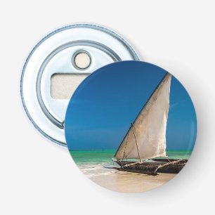 Traditional fishing boat on the beach bottle opener