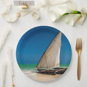 Traditional fishing boat on the beach paper plate