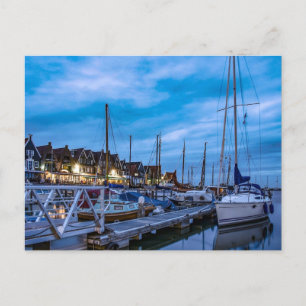 Traditional fishing town night scene postcard