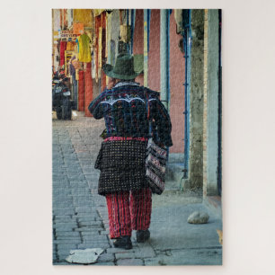 Traditional Man Walking Cobblestone Street Jigsaw Puzzle