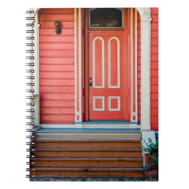 Traditional red painted wooden door and porchdoor, notebook (Front)