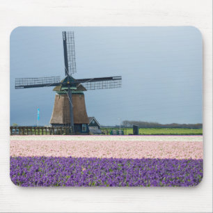 Traditional windmill with pink and purple flowers mouse mat