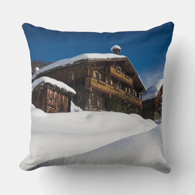 Traditional wooden cabins in de snow cushion (Front)