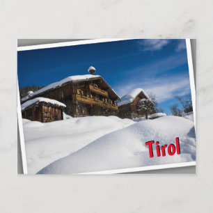 Traditional wooden cabins in de snow in Tirol Postcard