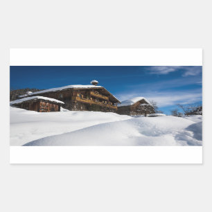 Traditional wooden cabins in de snow rectangular sticker