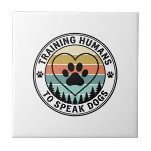 Training Humans to Speak Dogs Vintage Paw Badge_1 Tile
