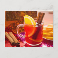 Transparent cup of tea with citrus, cinnamon