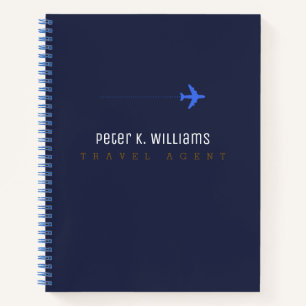 travel agent blue notebook with an aeroplane