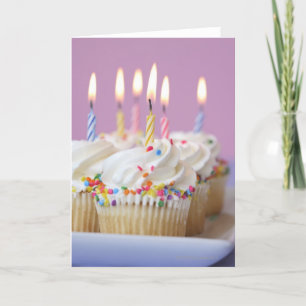 Tray of birthday cupcakes with candles card