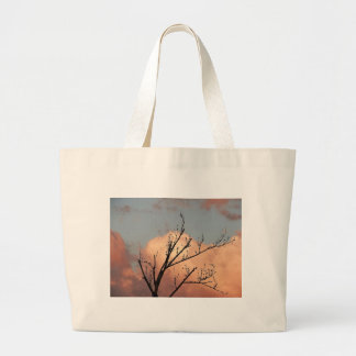 Trebranches full of black birds large tote bag