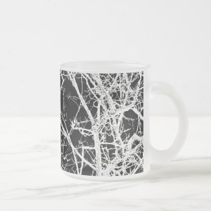 Tree branches on black background frosted glass coffee mug