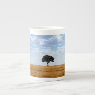Tree in an harvested wheat field bone china mug