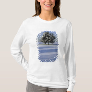 Tree in snow covered landscape T-Shirt