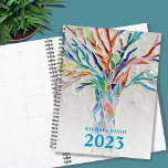 Tree of Life Personalized 2023 Planner<br><div class="desc">This unique Planner is decorated with a brightly coloured Tree of Life on a pale gray background. The original design was made in mosaic using tiny pieces of brightly colored glass. Customize it with your name and year. To edit further use the Design Tool to change the font, font size,...</div>