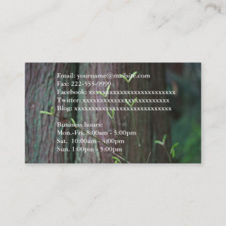 Tree trunk and spring green leaves full informatio business card