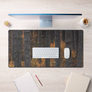 Trees and gold autumn foliage desk mat