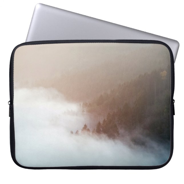 Trees on mountain covered with fogs laptop sleeve (Front)