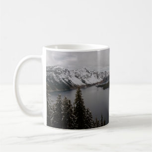 TREES ON SNOW COVERED MOUNTAIN NEAR BODY OF WATER COFFEE MUG