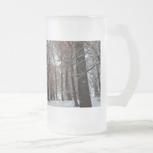 Trees , with orange leaves and snow frosted glass beer mug