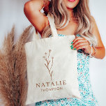 Trendy Boho Chic Terracotta Flower Personalised Tote Bag<br><div class="desc">Trendy Boho Chic Terracotta Flower Personalised Tote Bag, an exquisite blend of elegance and functionality tailored for the modern, stylish woman. This oversized tote bag is adorned with a beautifully detailed wildflower design in warm terracotta tones, capturing the essence of bohemian chic. Personalised with your monogram and name, this tote...</div>