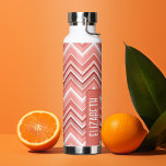 Trendy Chevron Pattern large name block coral Water Bottle<br><div class="desc">A bold, graphic design with colourful shades of coral zig zags with a fun colour block to add your name or any text. The bright chevron pattern is a modern, trendy pattern with a punch of colour. You can add a name, monogram or other custom text. If you need to...</div>