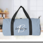 Trendy Dusty Blue Black White Script Monogram  Duffle Bag<br><div class="desc">This personalised duffel bag features a monogram and first name in modern black and white script on a stylish dusty blue background.</div>