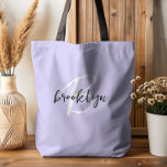 Trendy Lavender Black White Script Monogram  Tote Bag<br><div class="desc">This elegant personalised tote bag features a monogram and first name in modern black and white script on a trendy lavender background.</div>
