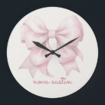 Trendy Pink Bow Personalised With Name Monogram Large Clock<br><div class="desc">Add a touch of timeless elegance to your decor with the Trendy Pink Bow Personalised With Name Monogram Large Clock. Featuring a chic preppy coquette bow in a soft pink watercolor design, this clock combines vintage girly charm with modern sophistication. The personalised name monogram makes it a unique and thoughtful...</div>