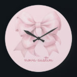 Trendy Pink Bow Personalised With Name Monogram Large Clock<br><div class="desc">Transform any room with the Trendy Pink Bow Personalised With Name Monogram Large Clock, a perfect blend of style and personalisation. This elegant clock features a preppy coquette bow in a soft pink watercolor design, making it a charming addition to any space. The personalised name monogram adds a unique touch,...</div>
