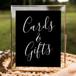 Trendy Script Black Wedding Cards and Gifts Sign<br><div class="desc">This simple and elegant wedding sign features the phrase "Cards and Gifts" in white script on a striking black background, offering a sophisticated touch to your event. Personalise the sign with optional custom text, such as your names, wedding date, or a heartfelt thank-you message, to make it truly unique. Perfect...</div>